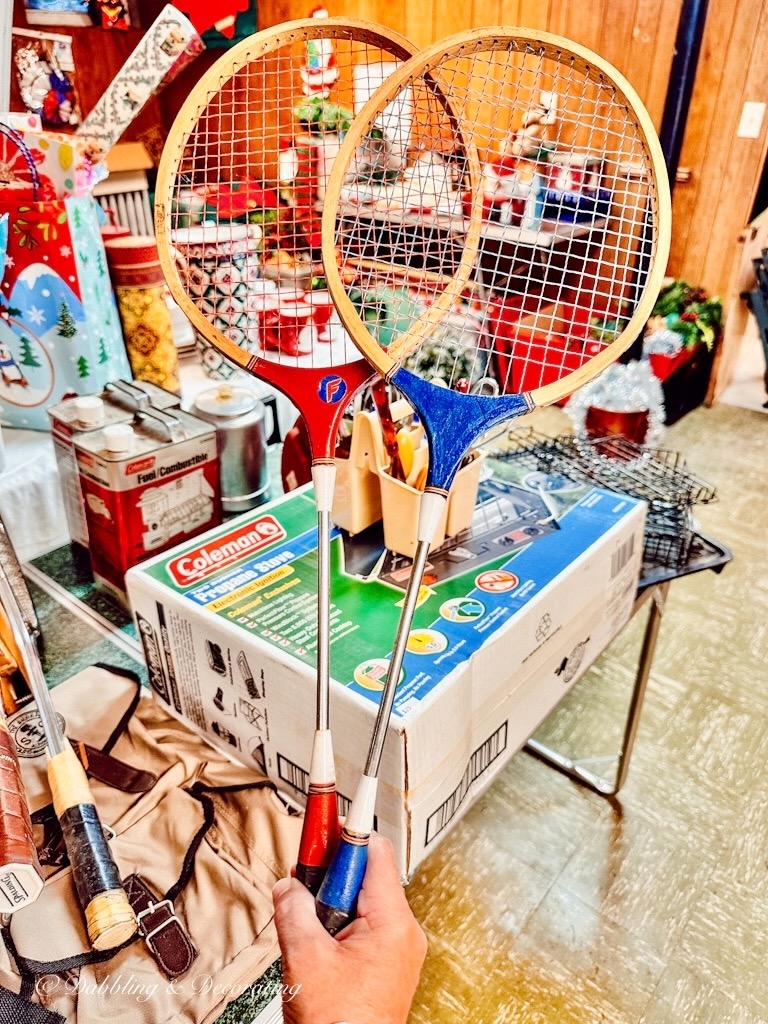 2 Old Badminton Racquets at estate sale in red and blue.