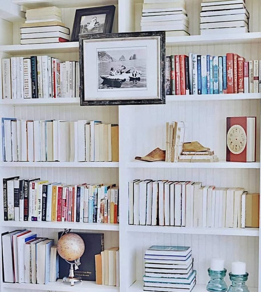 Built-in Bookshelves with Books Turned the Opposite Way Vintage room style.