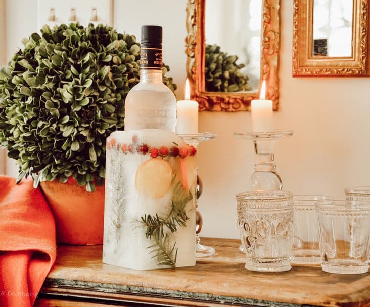 Beautiful DIY Ice bucket on wooden bench decorated for Christmas.