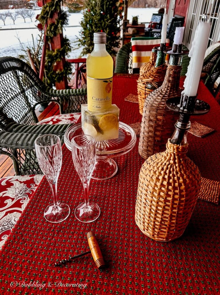 Limoncello in DIY ice bucket on Après Ski Theme Table on porch table.