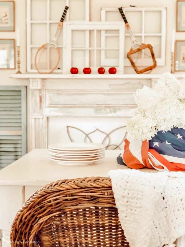 White Farmhouse Cottage Style Patriotic Decor in Dining Room with Tennis rackets, white hydrangeas and USA Flag.