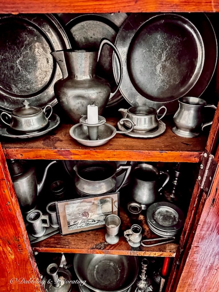 Antique American Pewter Collection in Antique Hutch.