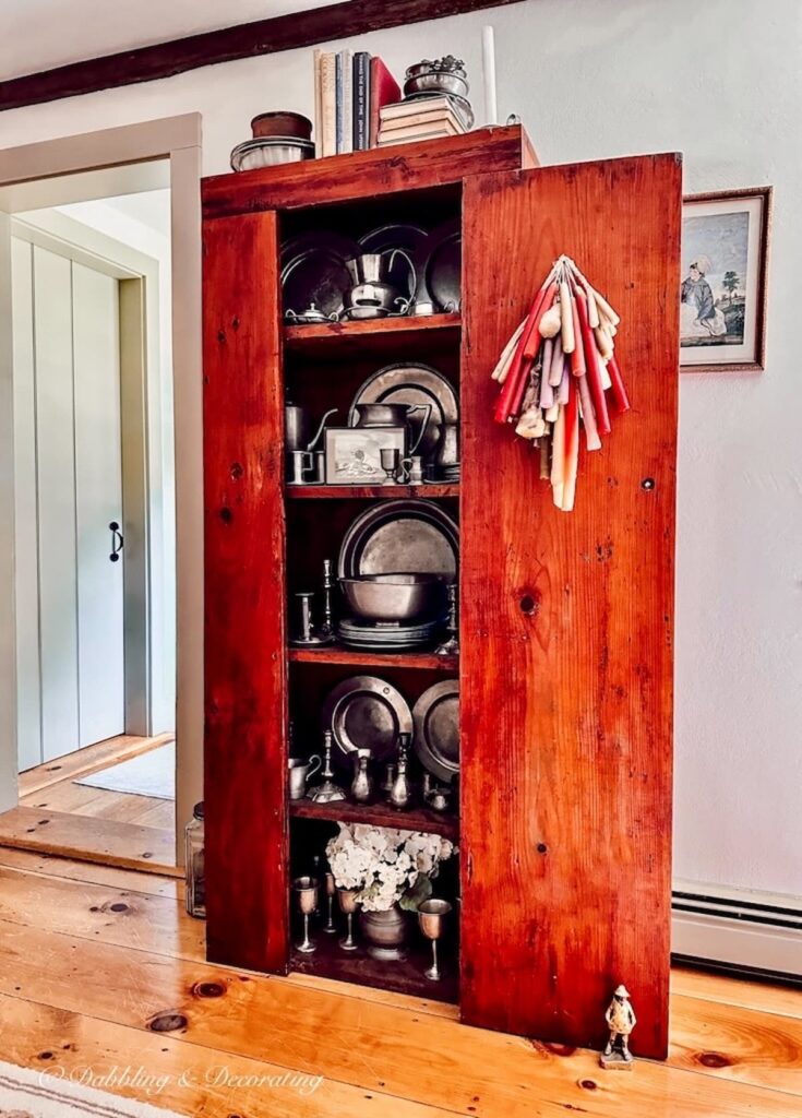 Antique hutch with pewter collection in Dining Room.