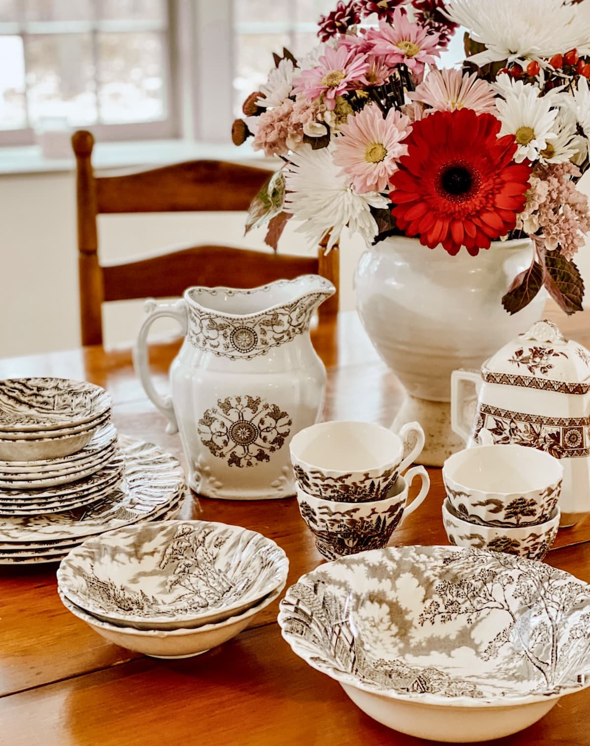 Antique Transferware Collection on Table with Flower Bouquet