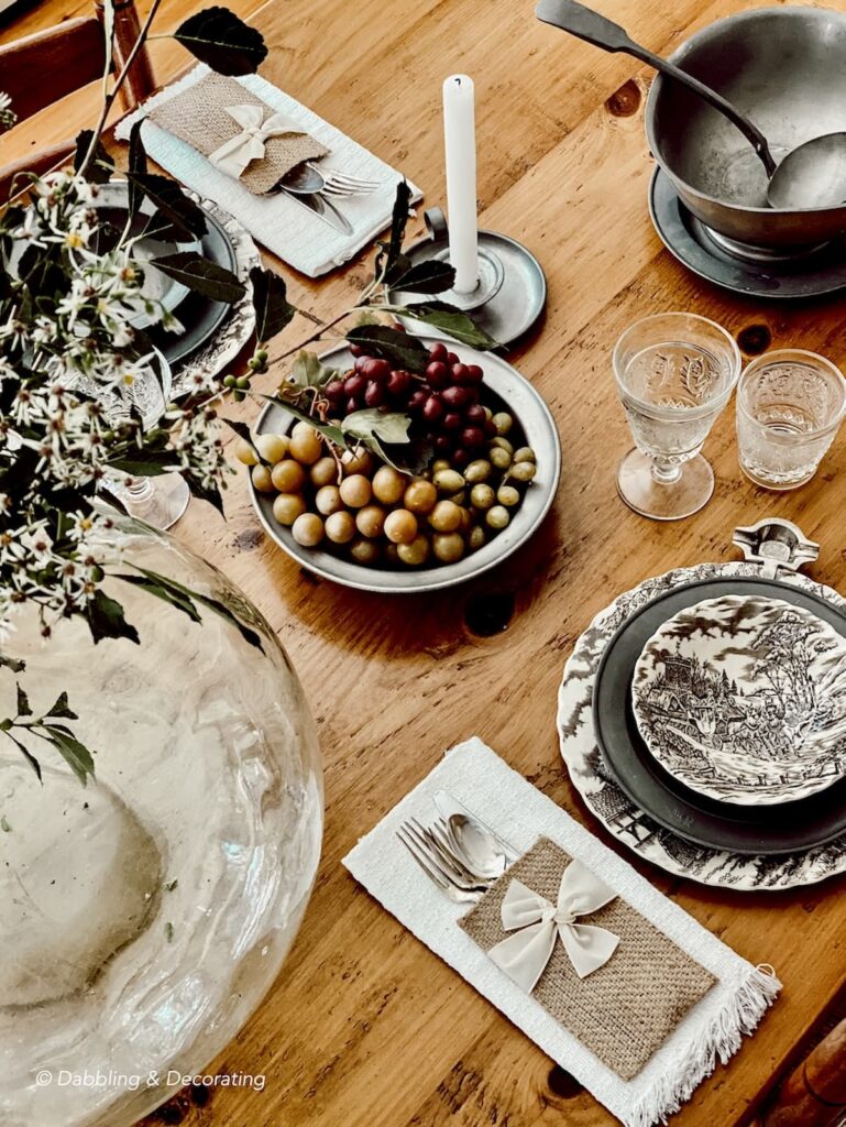 Primitive antique pewter and transferware table setting for fall.