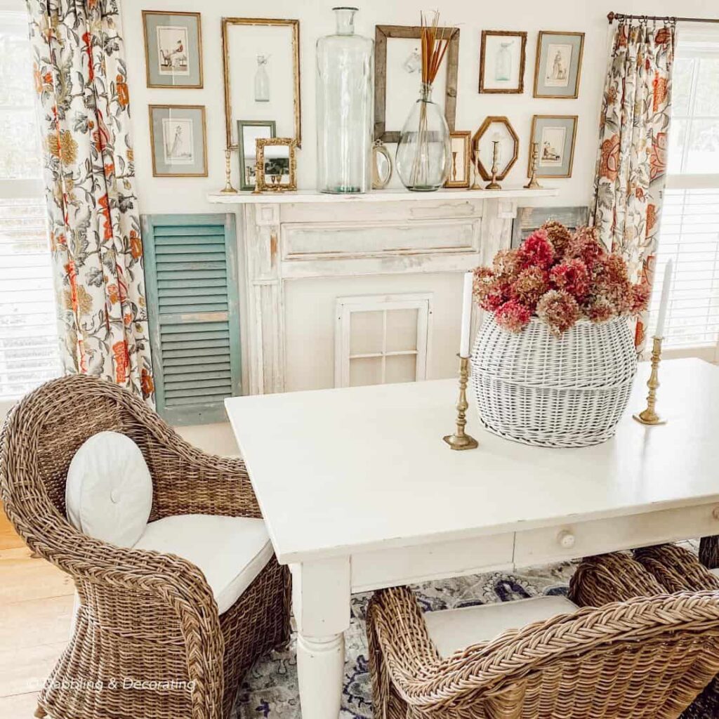 Vintage style dining room with vintage frame gallery wall over mantel.