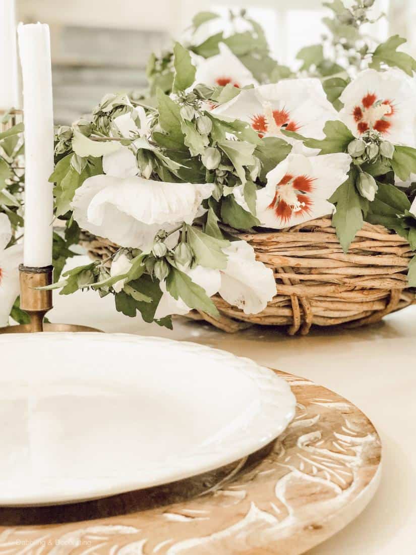 A plate with a flower on a table