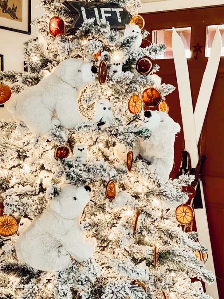 A thrifty Christmas tree decorated with polar bears and painted white vintage skis.