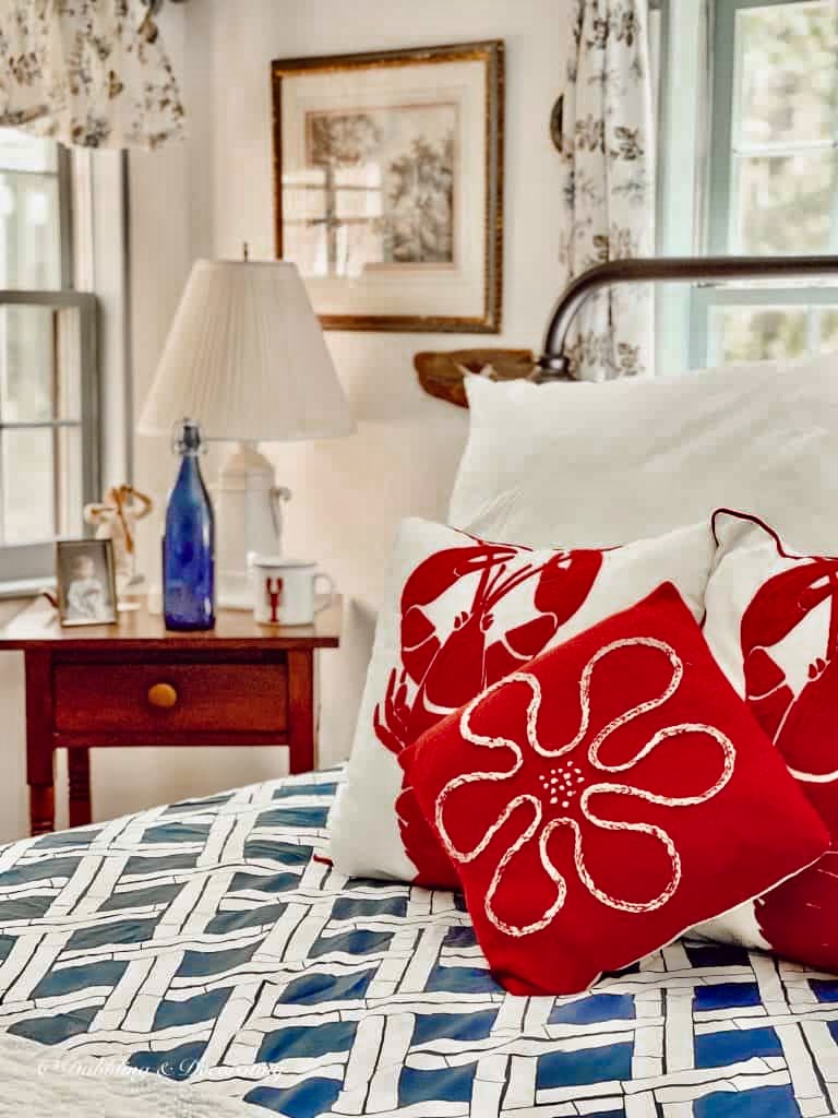 Cottage Core Room Ideas for Summer with red pillows on bed