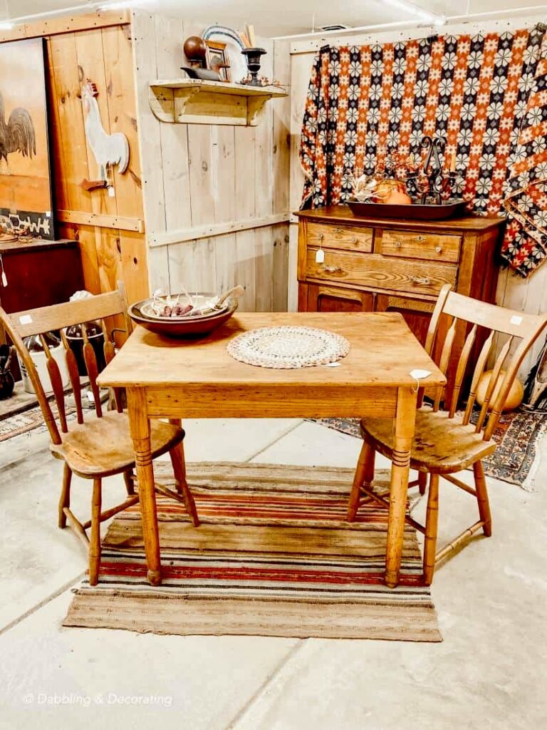 Charming Antique Table and Chairs for Two in antique store.