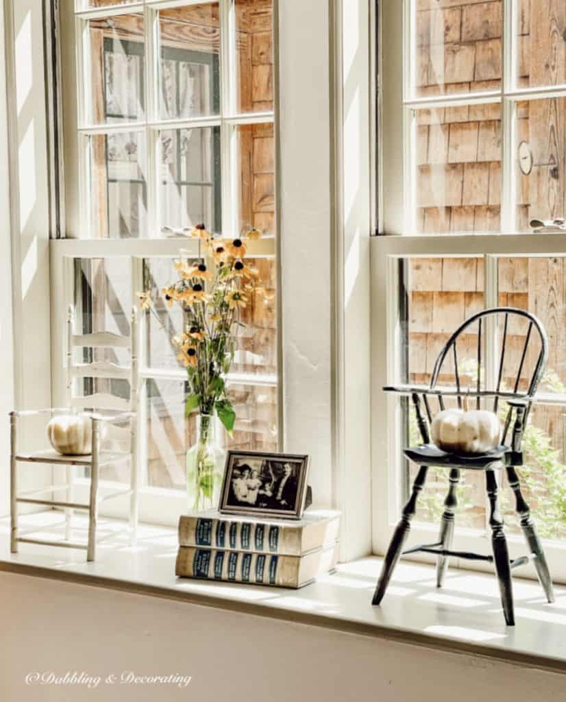 A window sill adorned with books creating a cozy and inviting decor for your home.