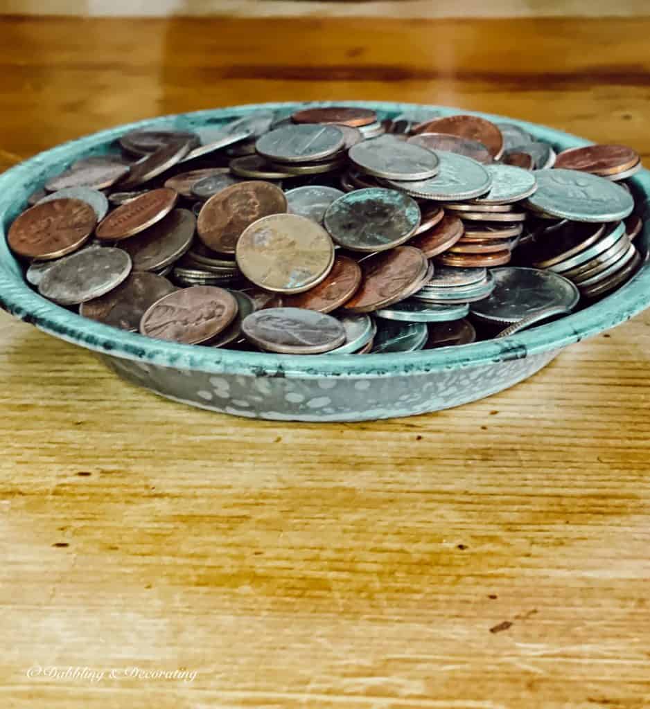 rustic bowl full of old copper pennies.