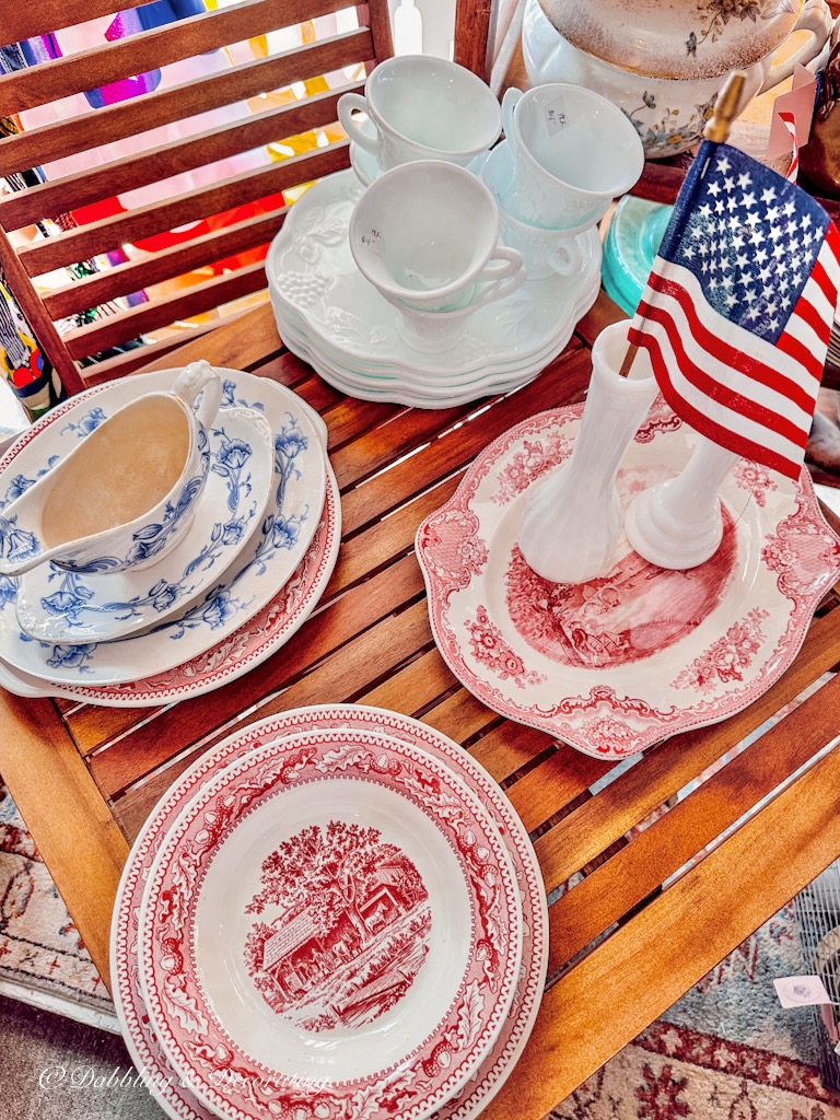 Red white and Blue vintage dishes in vintage booth display