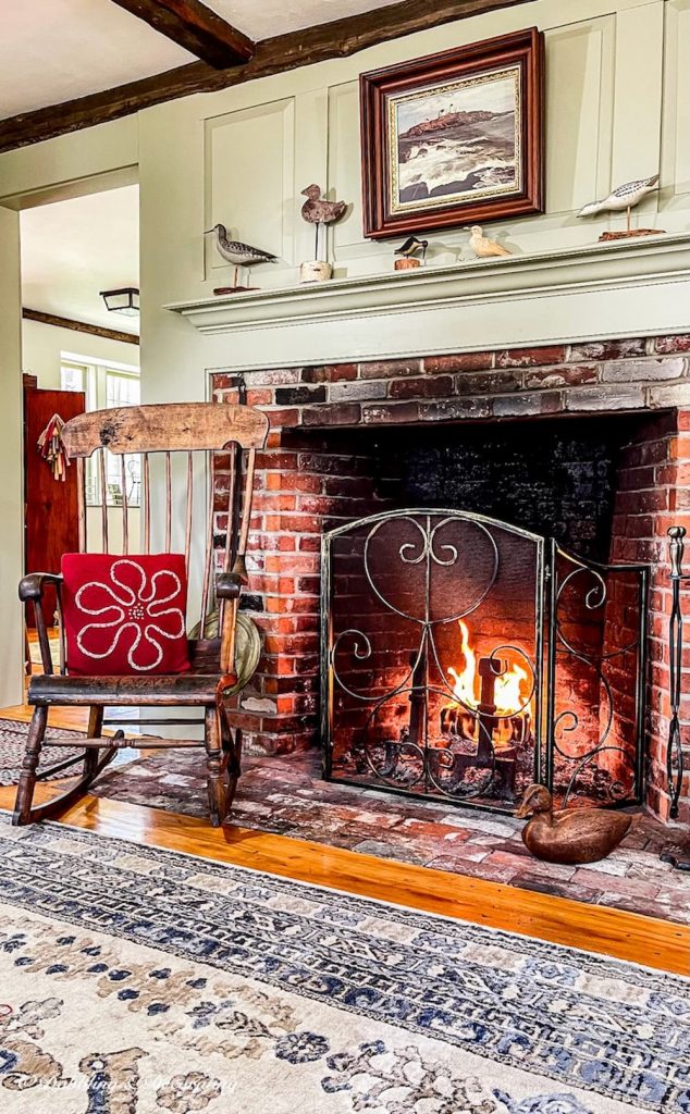 Antique Boston Rocker next to fireplace in colonial home.