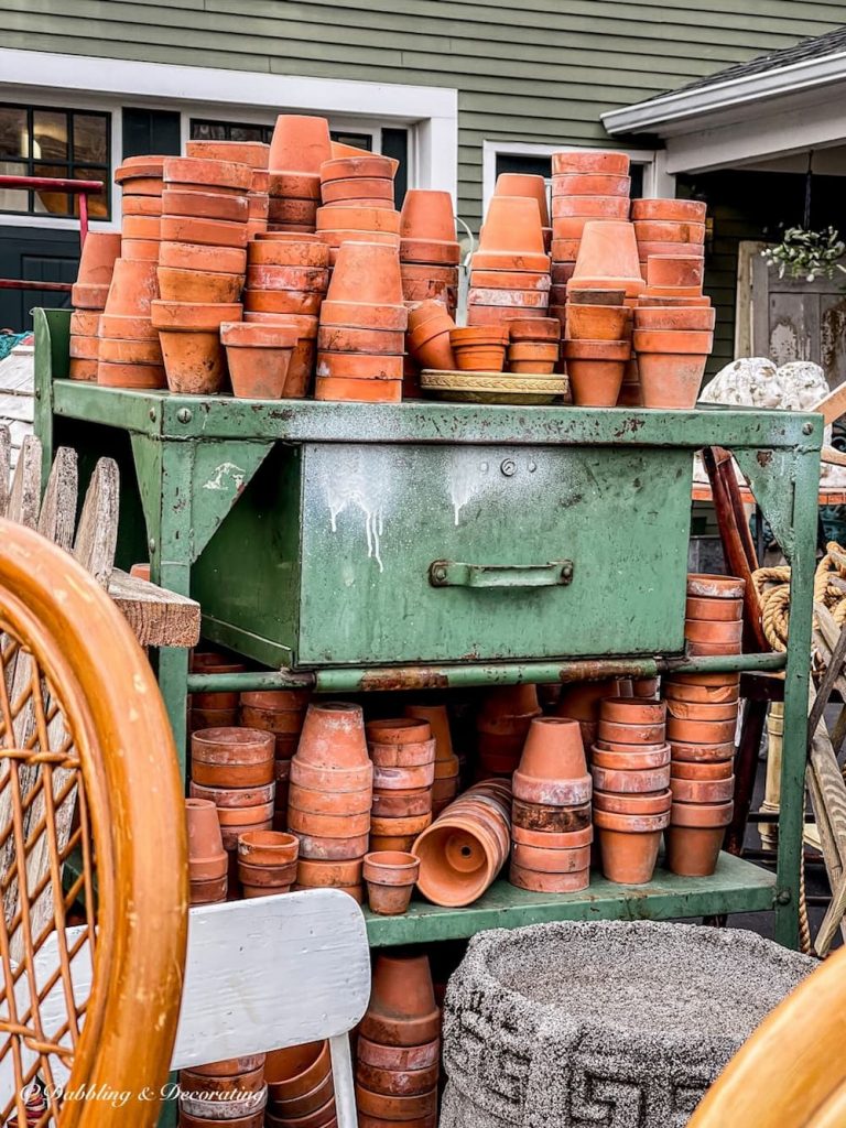 Terracotta Pots on green metal cart at Sage Farm Antiques.