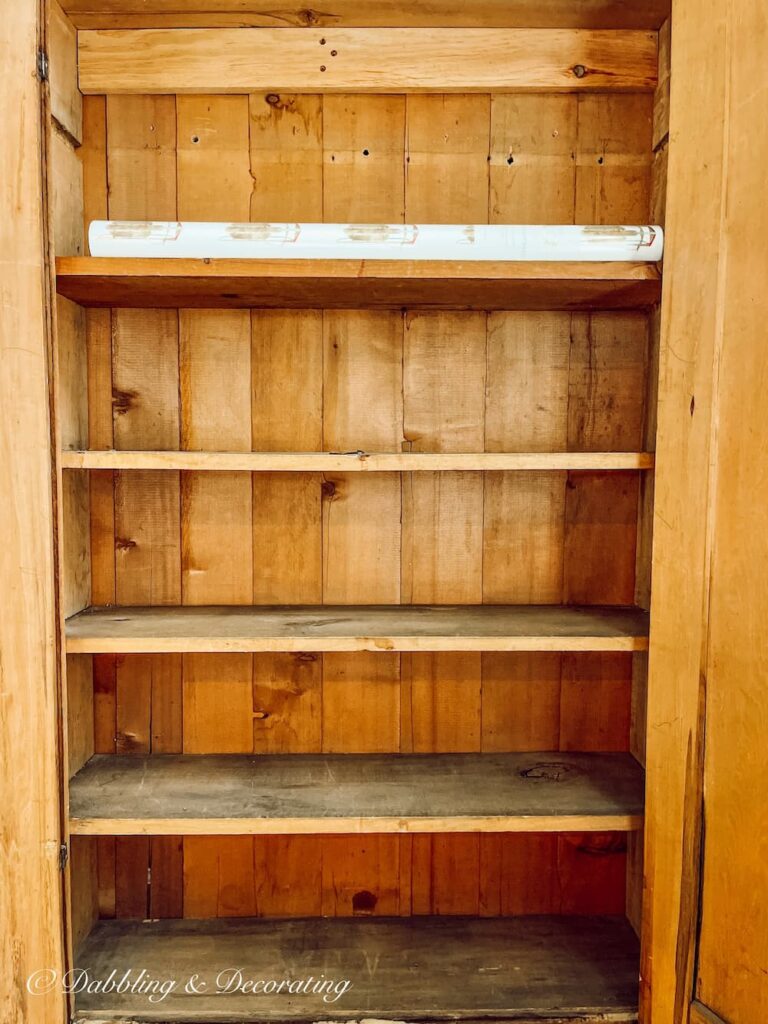 https://www.dabblinganddecorating.com/wp-content/uploads/2022/11/The-Cutest-DIY-Shelf-Liners-in-My-Old-Pine-Hutch-1-768x1024.jpg