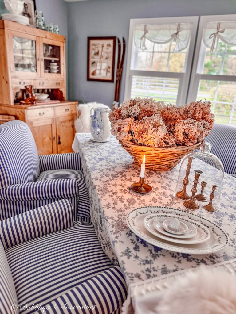 Blue and White Fall Dining Room Table with large pink hydrangeas basket centerpiece.