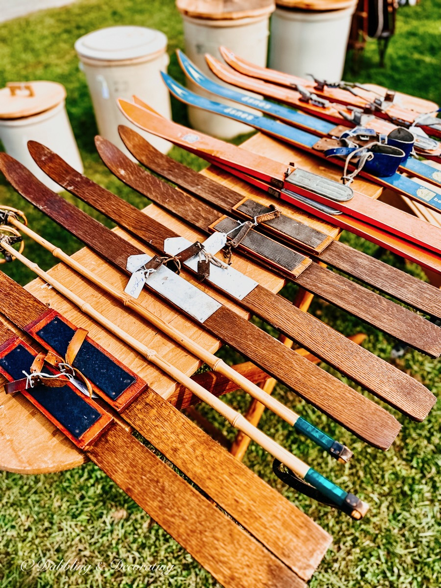 Vintage Children's Skis lined up at flea market.