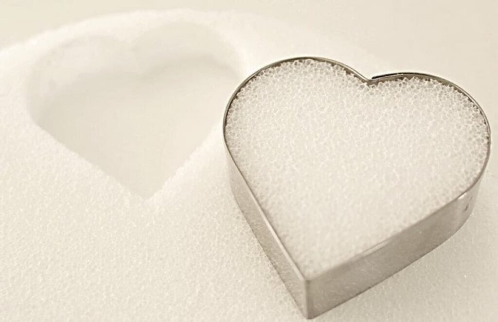 Heart Cookie Cutter and styrofoam with heart punched out.