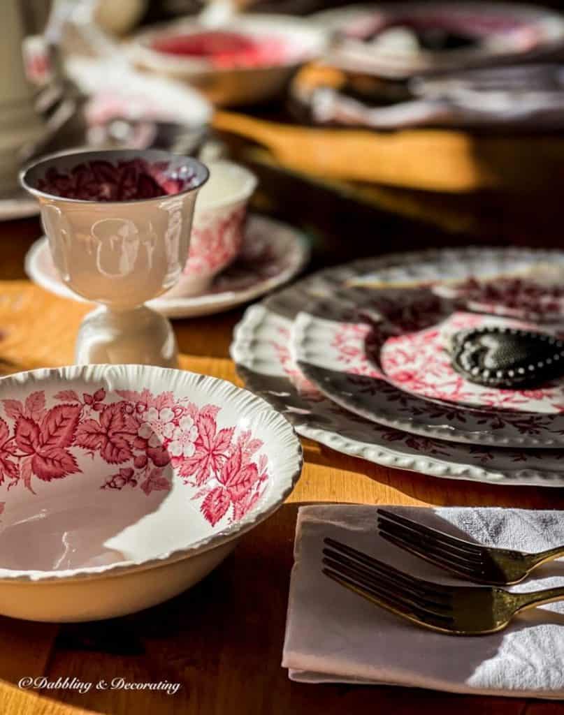 Pink and white vintage place setting close up on table.