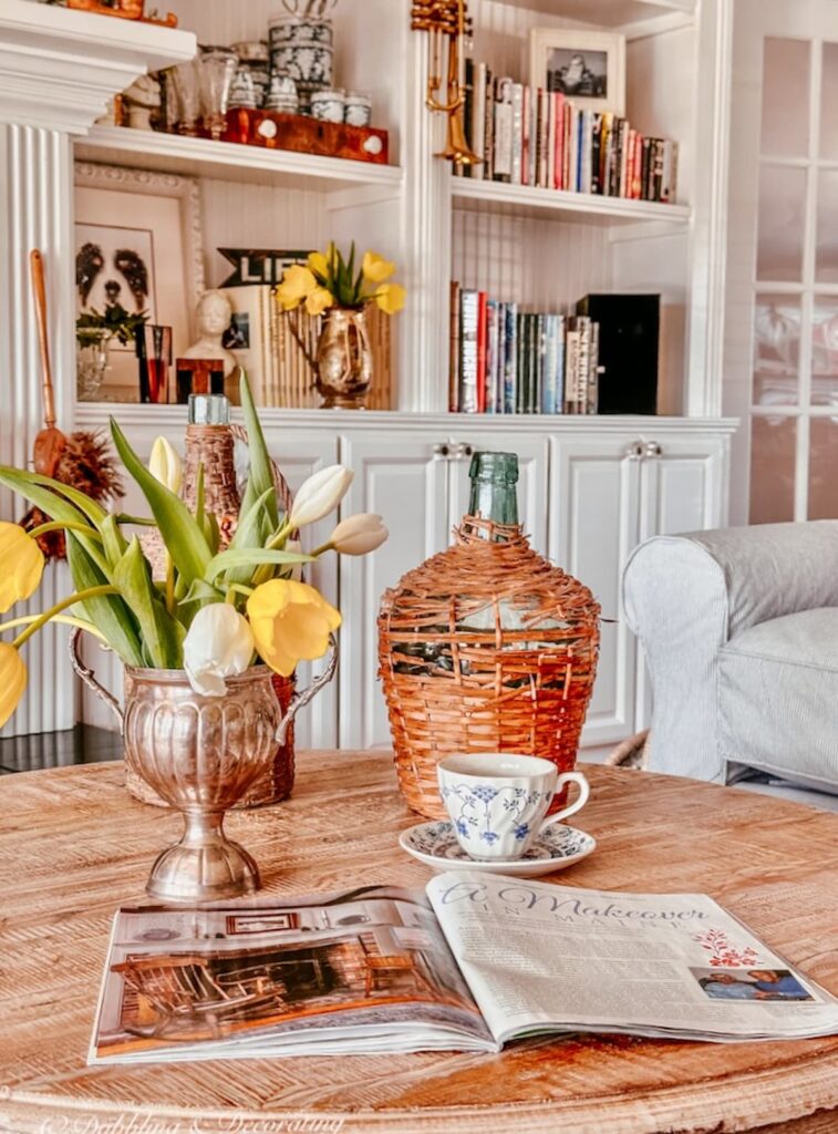 Coffee Table Decor, tulips, demijohns and magazine.