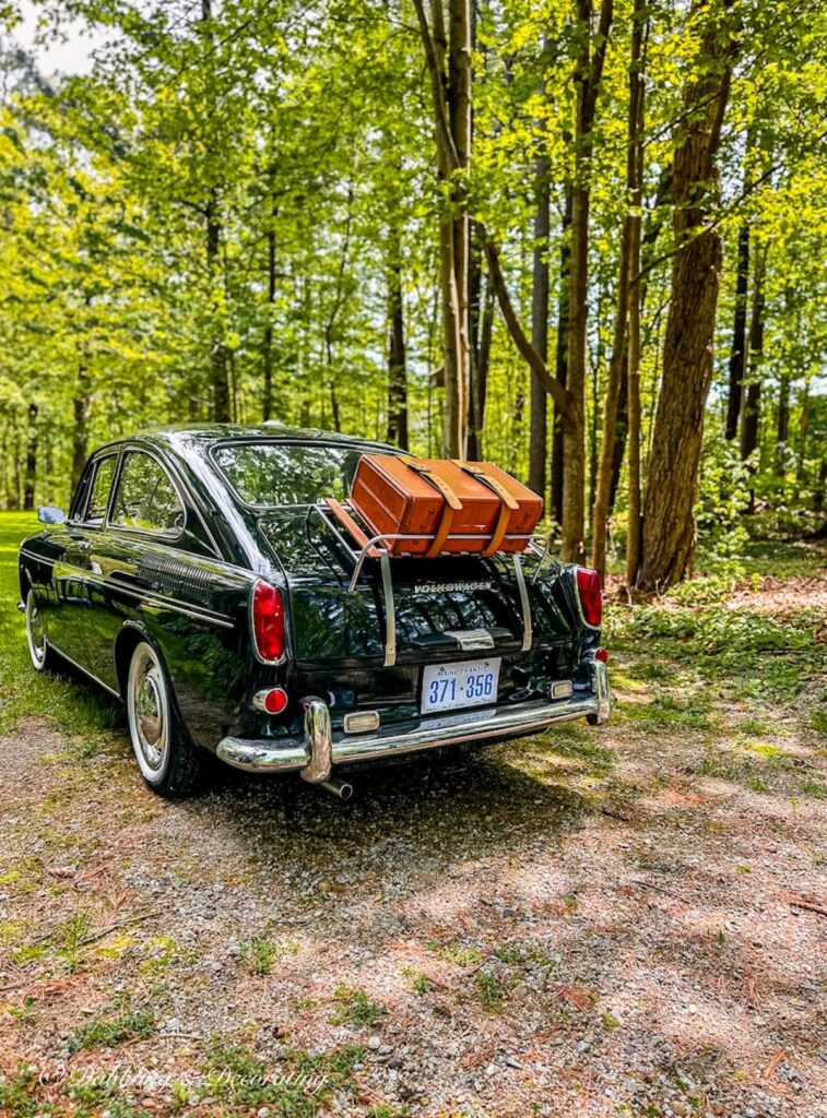 Classic VW Fastback with Vintage Luggage Rack and Suitcase on Trunk.