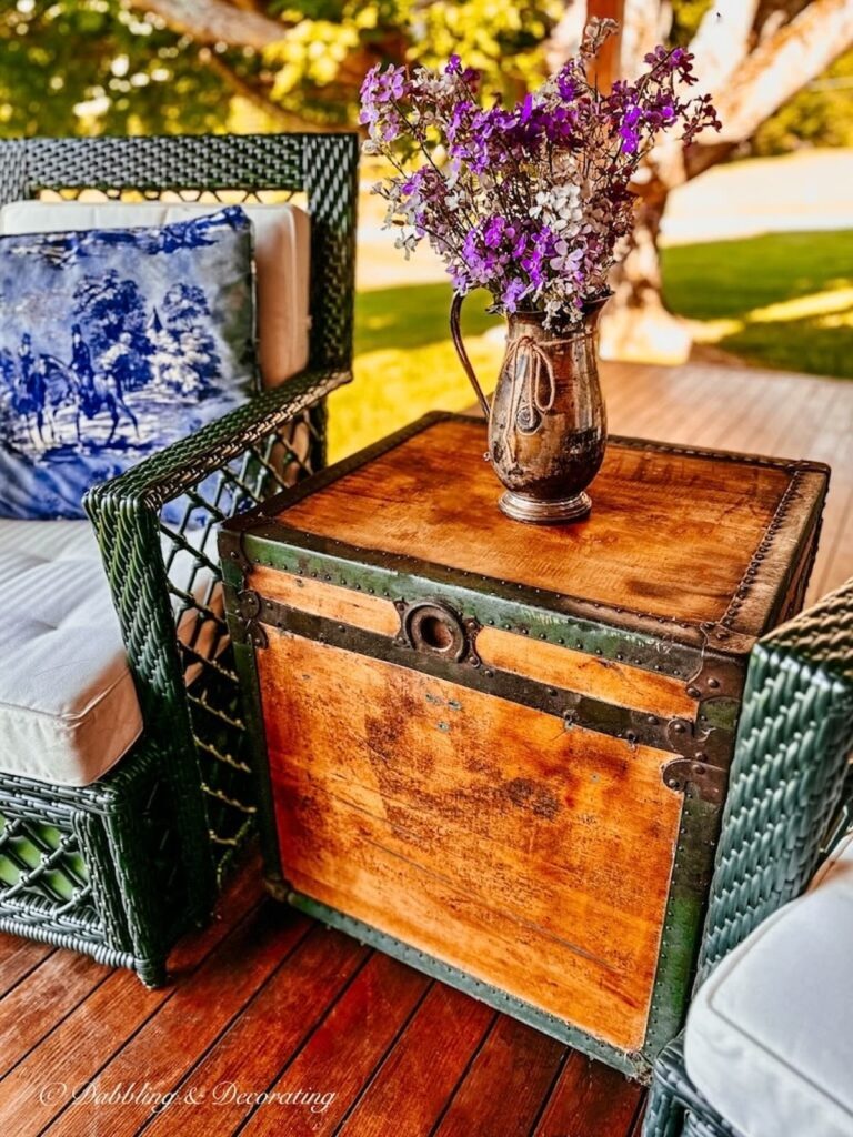 Antique Trunk Restored as Porch Table Accent with Flower Arrangement.