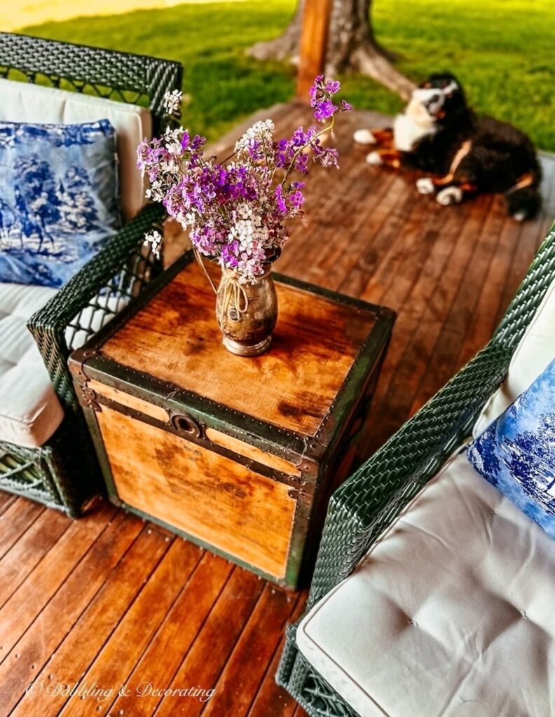 Antique Trunk Accent Table on Porch with Flowers and Bernese Mountain Dog