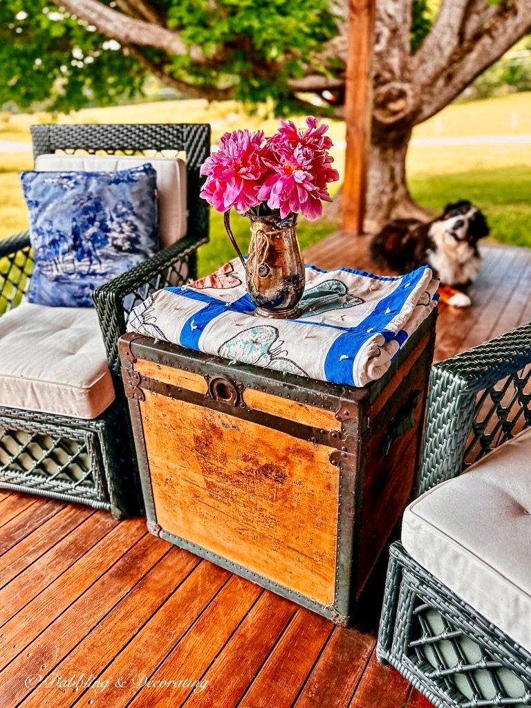 Antique Trunk Restored on Porch with Quilt and Flowers