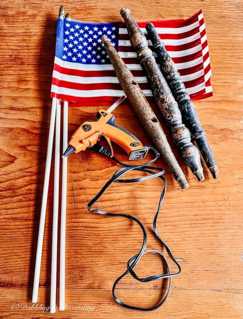 Three USA Flags and Spindles and Glue gun.