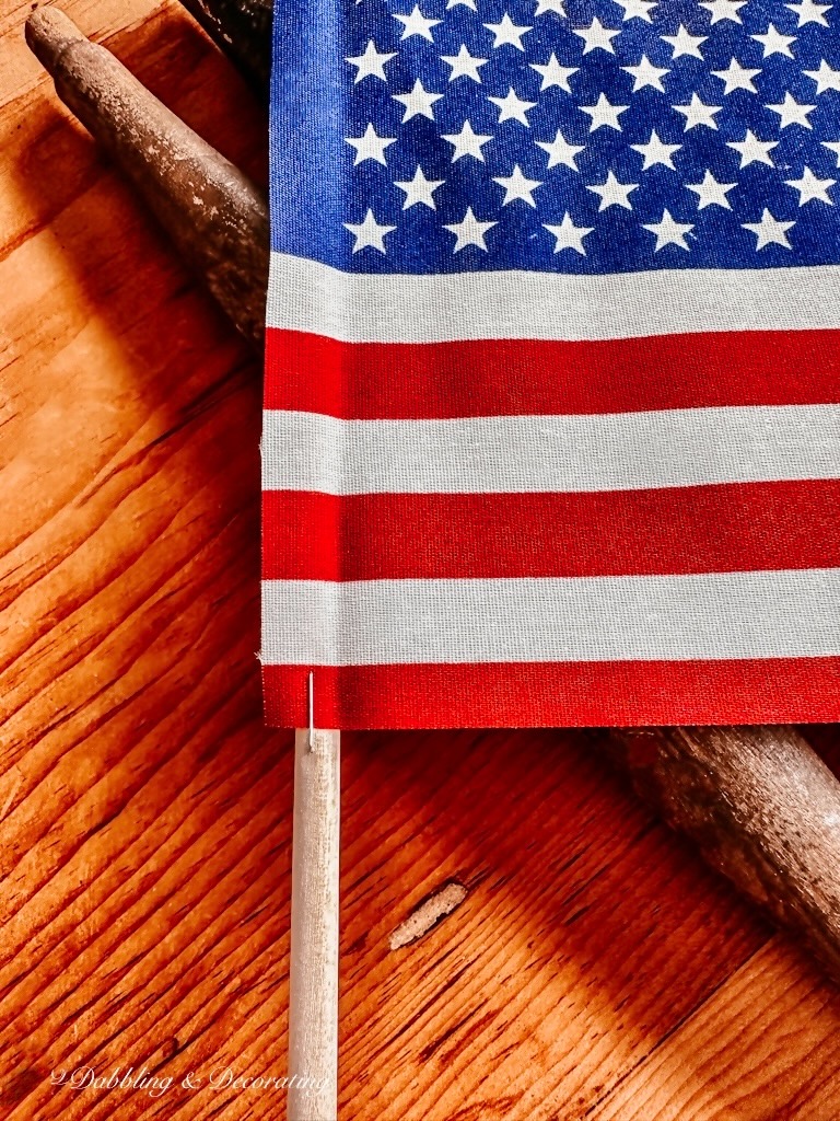 USA Flag Close Up with Staples on Wooden Pole