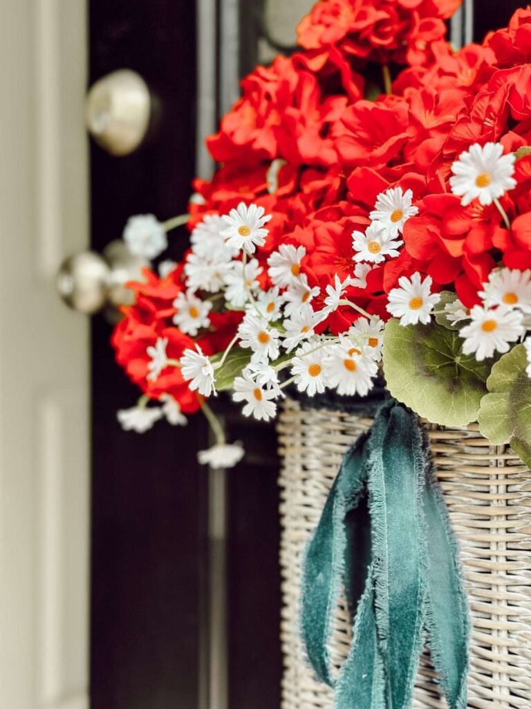 DIY Red, white, and blue basket door wreath. on blue door.