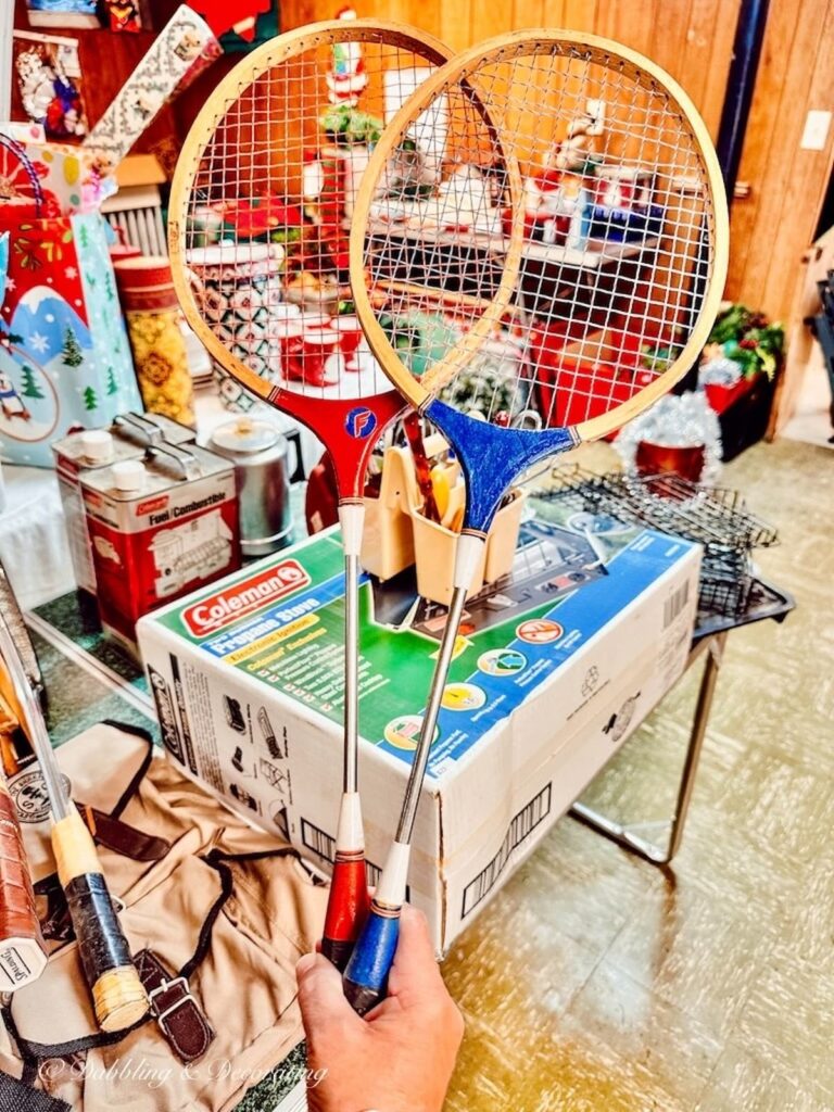 Red and Blue Badminton Rackets at Estate Sale in Hand.