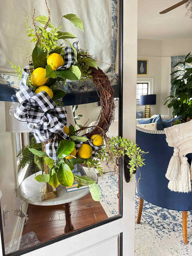 Spring Summer wreath with lemons and fresh greenery on front door.