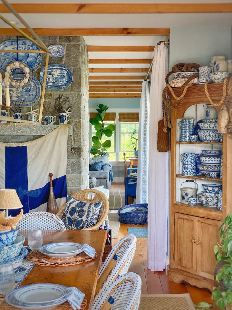 Nautical Signal Flag on fireplace mantel in blue and white dining room home.