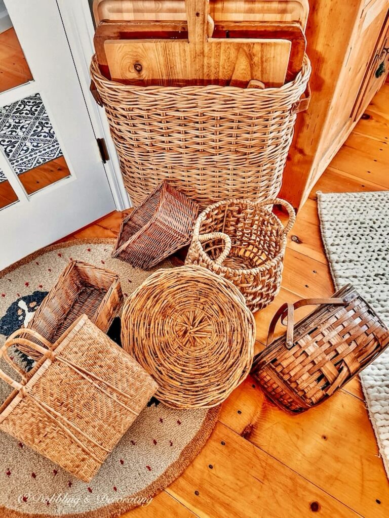 Various vintage basket on the floor with breadboards.