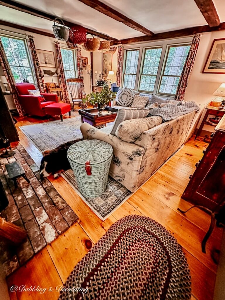 Vintage style colonial living room with bernese mountain dog and collectibles.