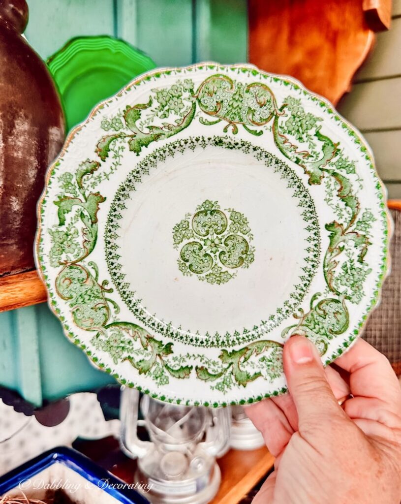 Vintage Green and white small plate in hand.