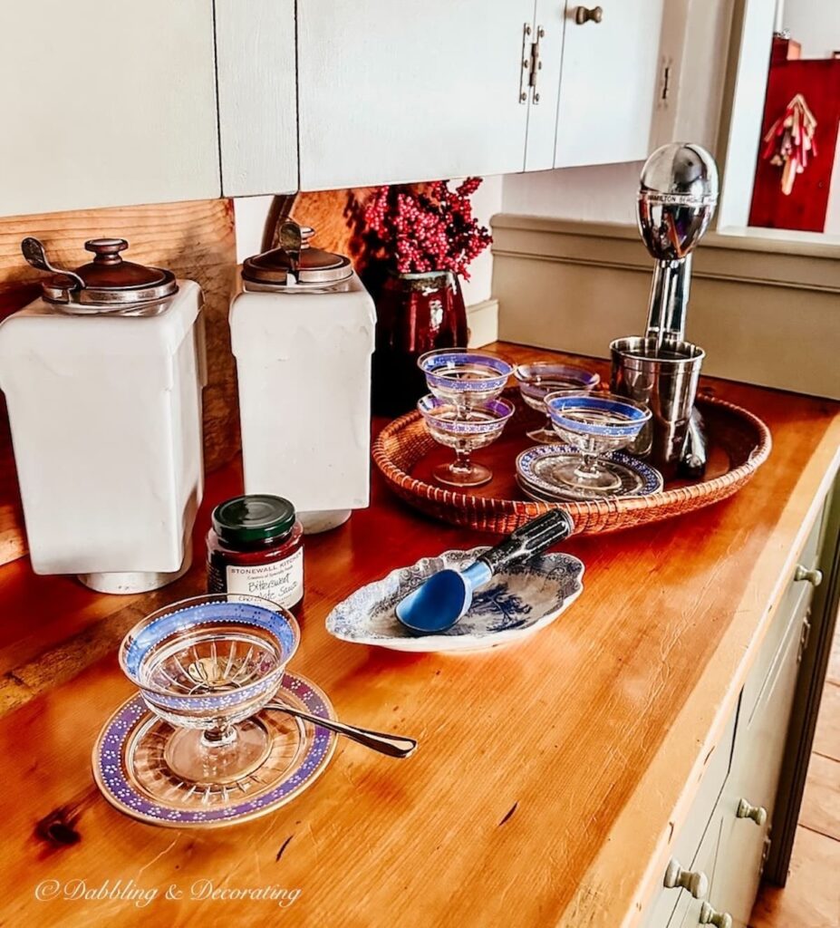 Old Fashioned ice cream sundae bar on country wooden kitchen counter.