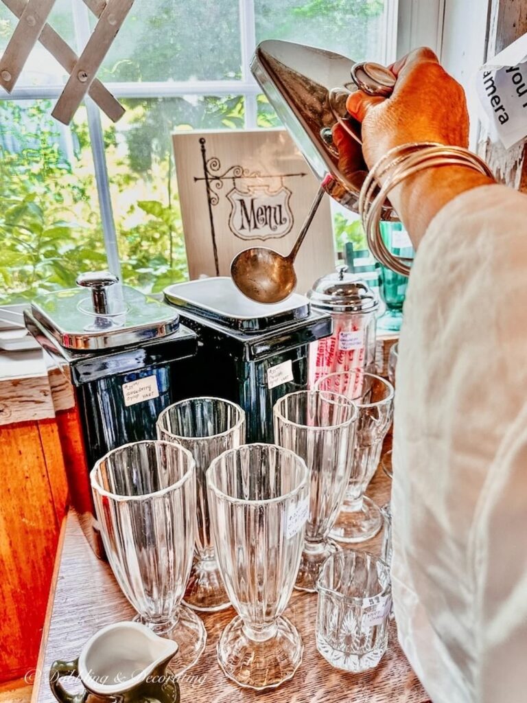 Soda fountain glassware with two ice cream syrup fountain containers at Sage Farm Antiques