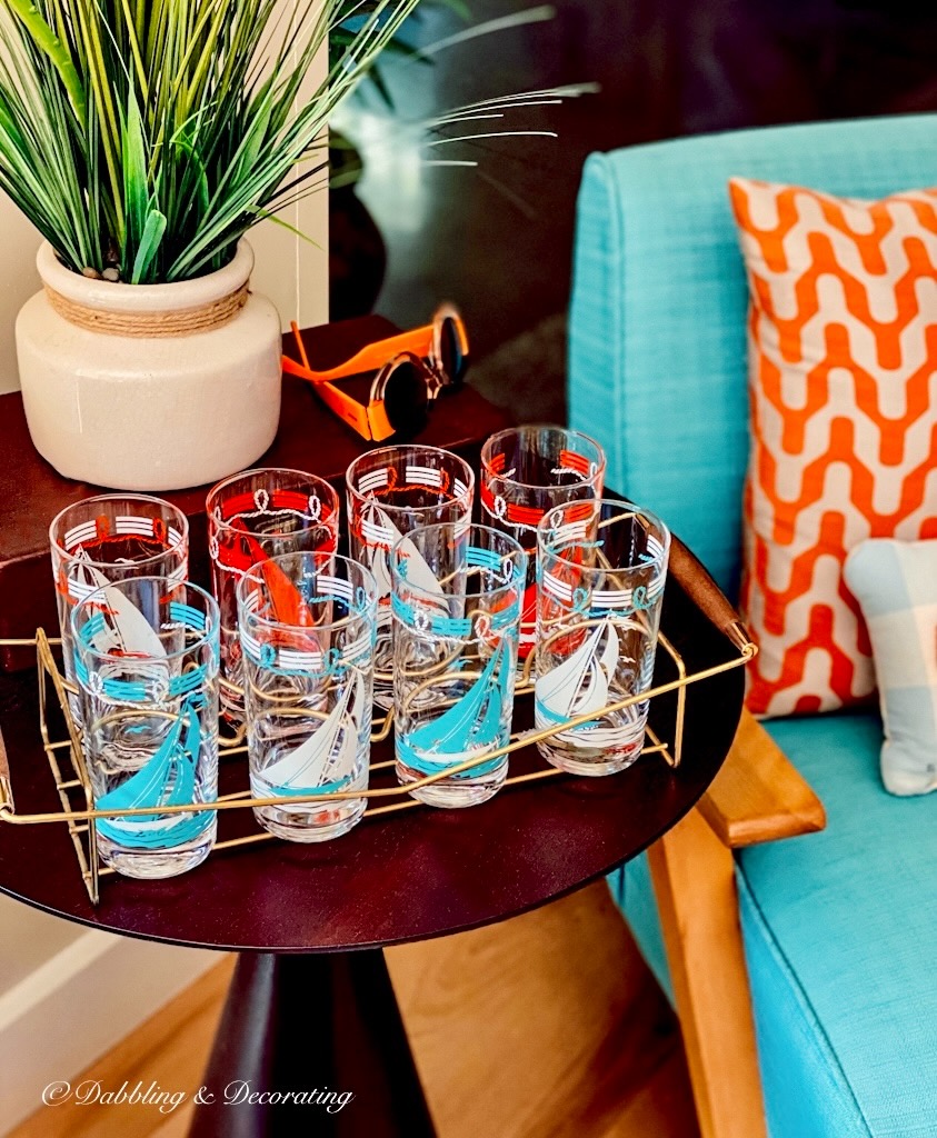 Retro set of glassware on table in blue and orange.