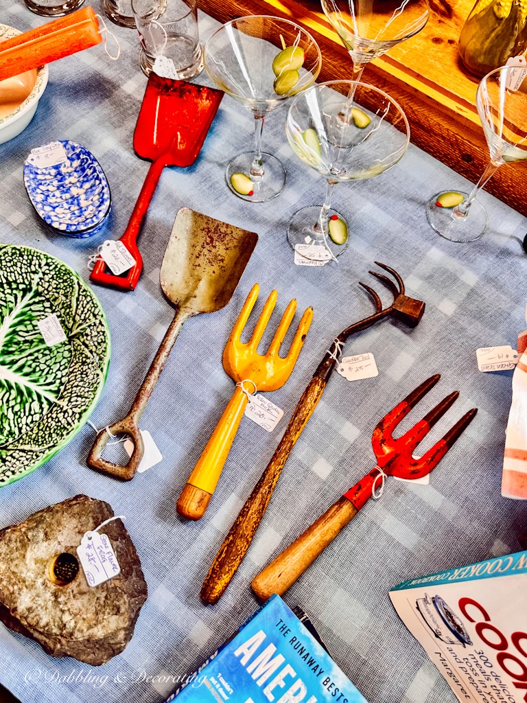 Vintage colorful garden tools on table at Sage Farm Antiques.