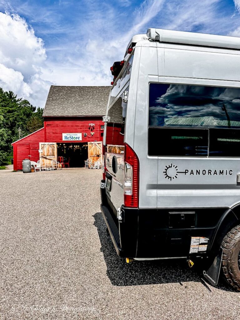 White Panoramic RV in front of Habitat for Humanity Restore in Rockport, Maine.