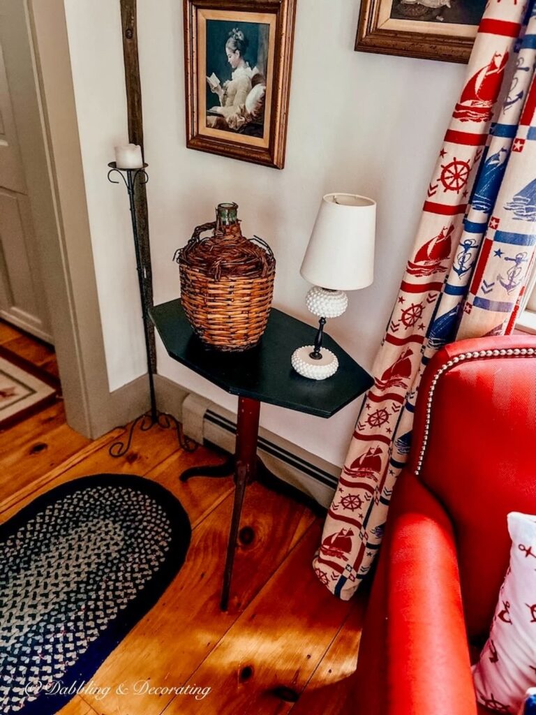 Vintage demijohn in coastal Maine home nautical corner of home.