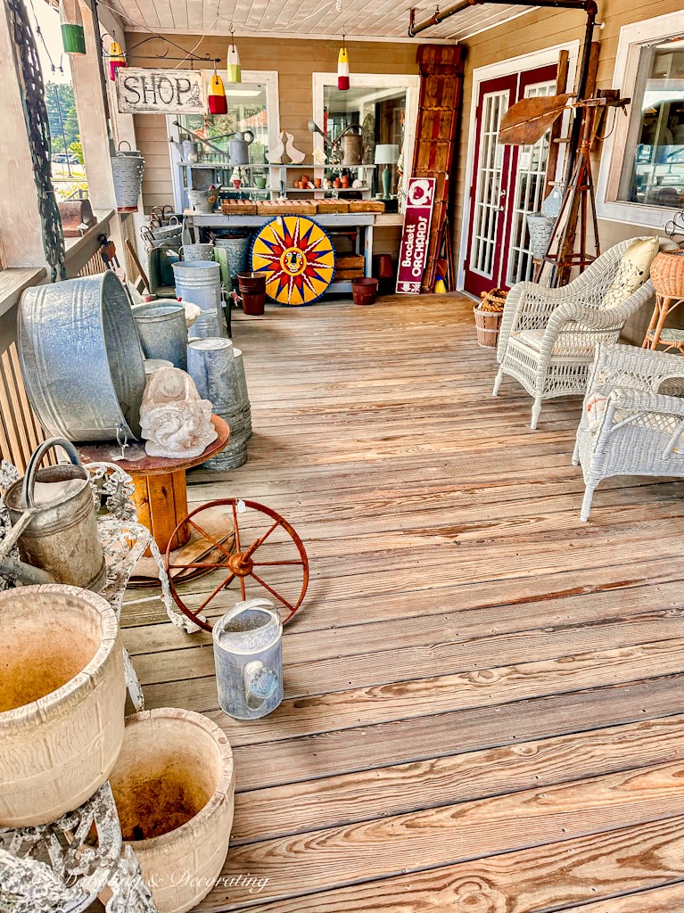 Gurley's Antique shop front porch with antiques in Scarborough, Maine.