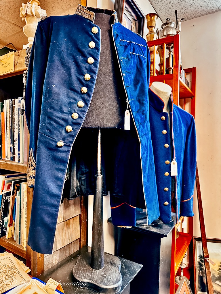 Blue Men's Military Jackets displayed in Antique Store.