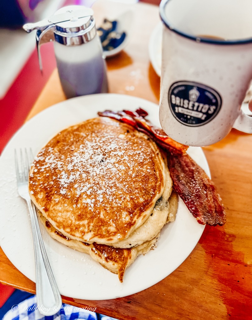 Blueberry pancakes with bacon and coffee