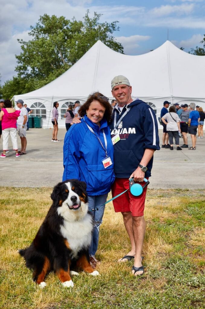 Woman and Man with Bernese Mountain Dog.