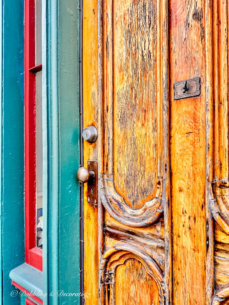 Wooden Nova Scotia Door on Green and Red house in Nova Scotia.