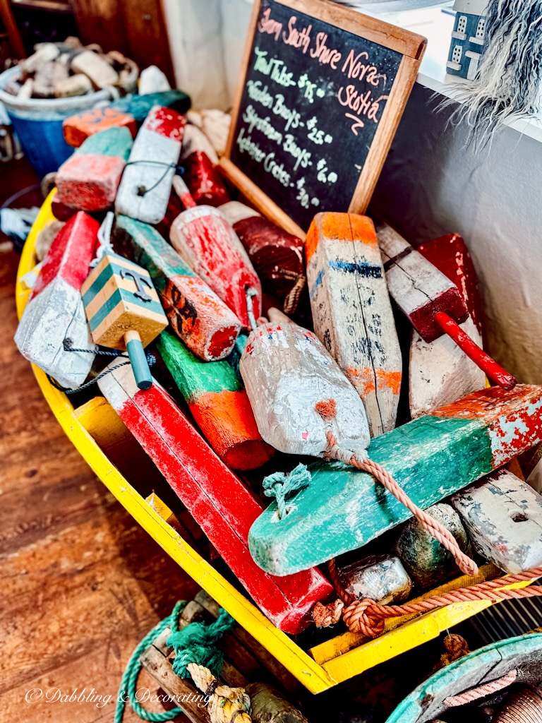 Small boat filled with lobster buoys in Mom's Buy and Sell Store.